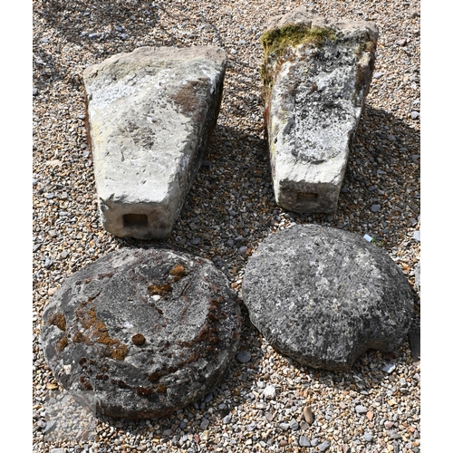 18 - A trio of antique granite staddle stones, of square tapering form, with circular caps, rough hewn an... 