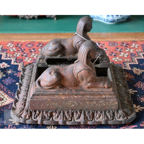 19 - An old cast iron twin 'Sphynx' mounted boot-scraper, no brushes