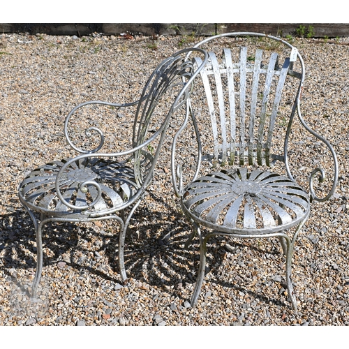 20 - A pair of Francois Carre designed sprung seat garden chairs, later painted silver and a/f (2)