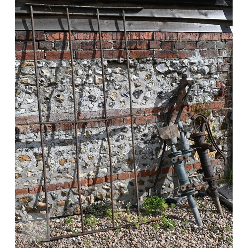 24 - Assorted old weathered cast iron items incl. a wall mounted blacksmith's vice; wall mounted hayrack;... 