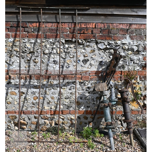24 - Assorted old weathered cast iron items incl. a wall mounted blacksmith's vice; wall mounted hayrack;... 