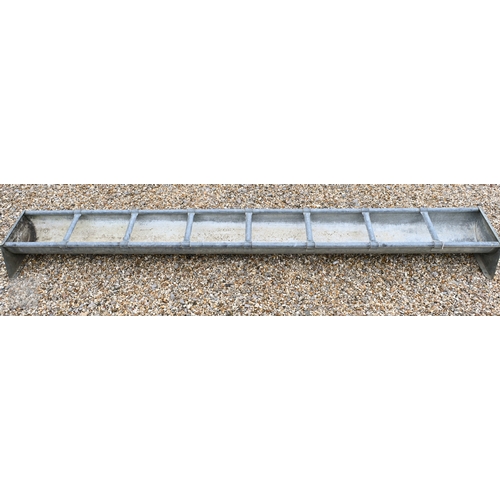 27 - A galvanized eight bay feeding trough, as a planter, cm long