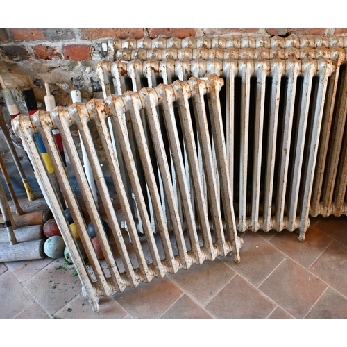 29 - Five various sized vintage cast iron column radiators to/with a heated towel radiator, for recomissi... 