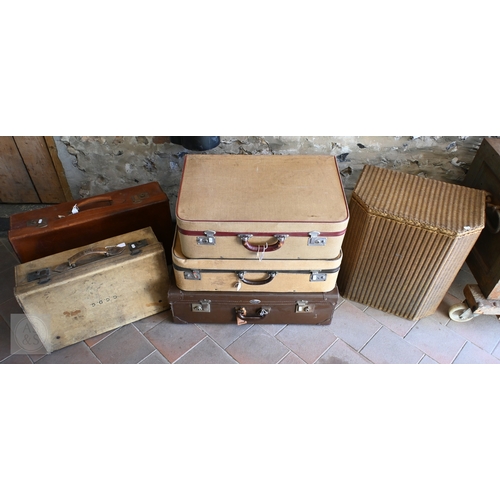31 - A stack of five assorted vintage travel cases to/w a Lloyd Loom 'Lusty' laundry bin, gold