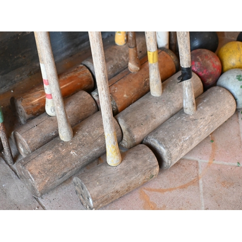 32 - Eight assorted vintage croquet mallets including Jacques and Slazenger to/with a quantity of iron ho... 