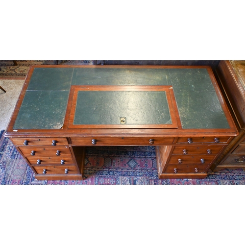 33 - A large antique mahogany twin pedestal desk, in three sections, the green inset skiver top with hing... 