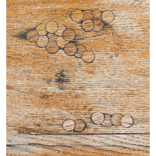 34 - A large oak refectory dining table, the framed wide plank top raised on square supports united by a ... 