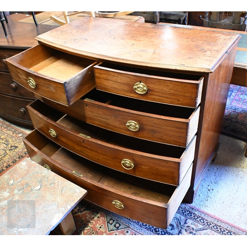 35 - A Victorian mahogany bowfront chest of two short over three long graduated drawers, with oval brass ... 