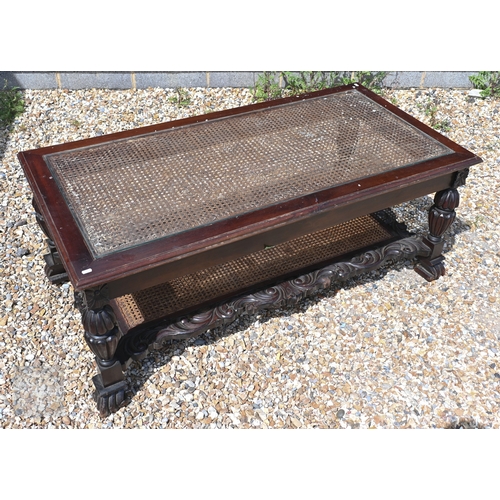 37 - A glass-topped Chippendale style coffee table with caned panel and conforming under tier, 139 cm x 7... 