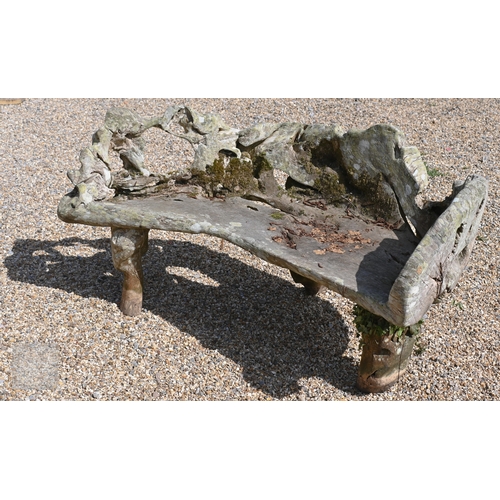 4 - An artisan sculptured solid teak root garden bench, weathered, 150 cm long