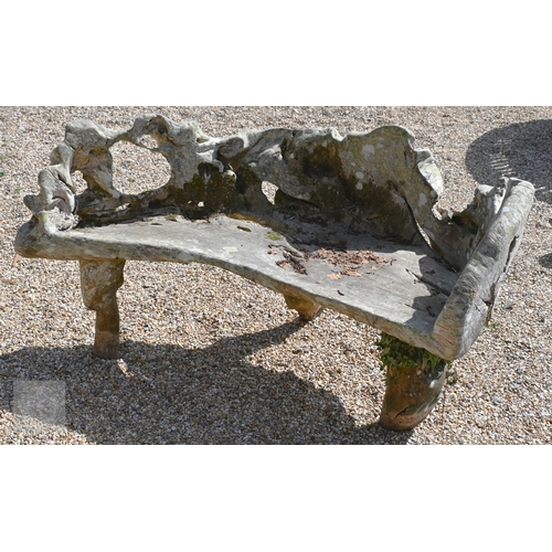 4 - An artisan sculptured solid teak root garden bench, weathered, 150 cm long