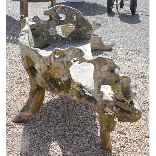 4 - An artisan sculptured solid teak root garden bench, weathered, 150 cm long