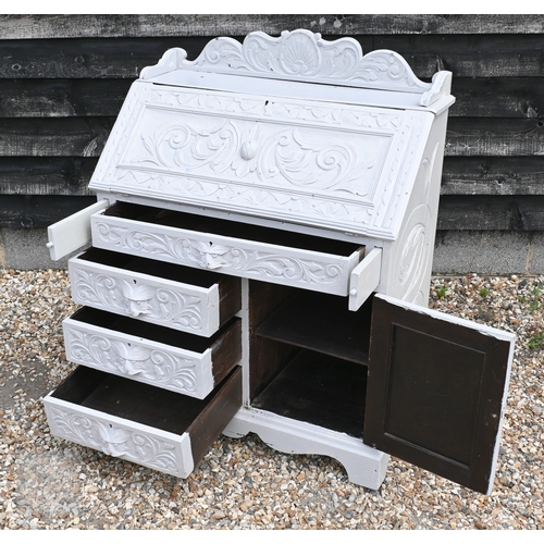 44 - An antique carved oak bureau later painted pale grey, with carved lion mask drawer pulls and 3/4 gal... 