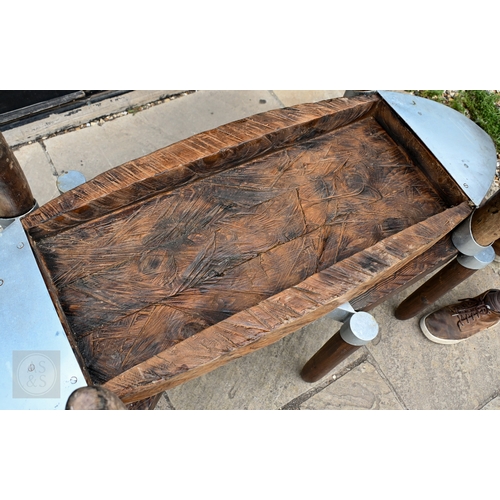 45 - Andrew Webb, a trio of aluminium mounted aeronautical inspired occasional tables, pine, the largest ... 