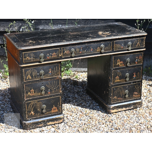 53 - A Chinoiserie painted twin nine drawer pedestal desk, very distressed surface finish, early 20th cen... 