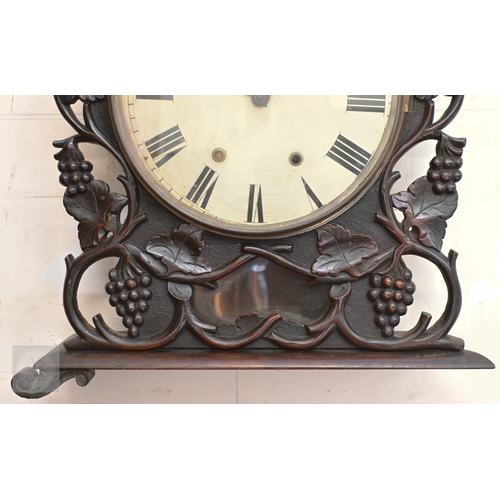 56 - A mid 19th century leaf and vine carved wall clock, incomplete and a/f, 50 cm w x 58 cm h