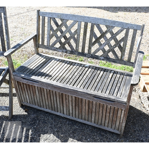 6 - A weathered teak lattice back box bench to/with a pair of folding teak chairs, all a/f (3)