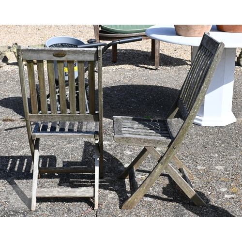 6 - A weathered teak lattice back box bench to/with a pair of folding teak chairs, all a/f (3)