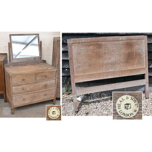 69 - Heal & Son, London - a limed oak mirror back dressing chest with four drawers, ivorine plaque to... 