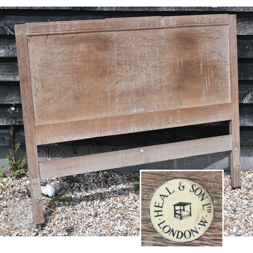 69 - Heal & Son, London - a limed oak mirror back dressing chest with four drawers, ivorine plaque to... 