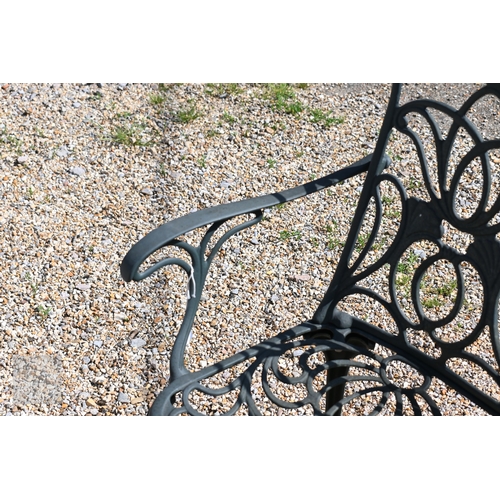 8 - A black painted alloy garden bench, 119 cm long