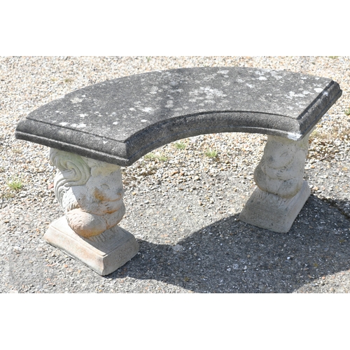 13 - A weathered three piece cast stone garden bench, the curved seat raised on 'squirrel' bases, 104 cm ... 