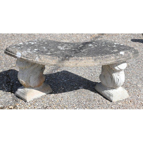13 - A weathered three piece cast stone garden bench, the curved seat raised on 'squirrel' bases, 104 cm ... 
