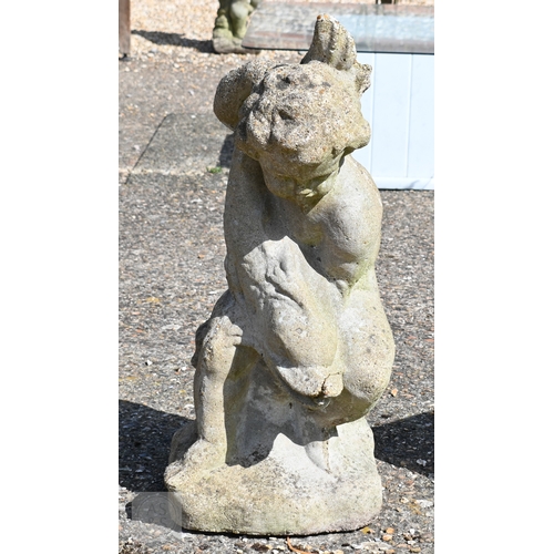 14 - A weathered Regency style cast stone putto and dolphin water feature, 74 cm h
