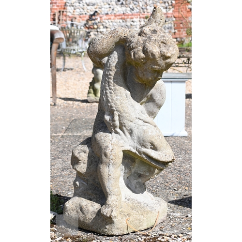 14 - A weathered Regency style cast stone putto and dolphin water feature, 74 cm h