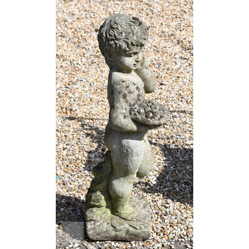 22 - A weathered cast stone statue of a cherub, 70 cm high
