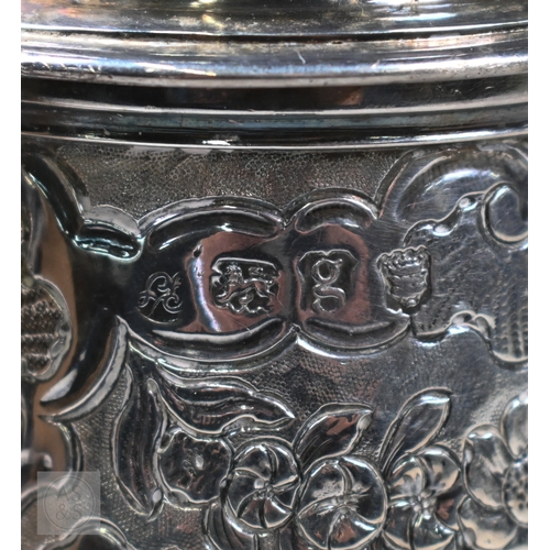 118 - A George II silver coffee pot of tapering form, the domed cover with pine-cone finial, scrolling fru... 