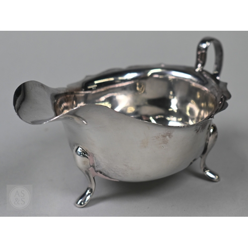 120 - A silver cream boat Viners, Sheffield 1961 and two pairs of sugar tongs, 5.2oz (163g) total, to/w a ... 