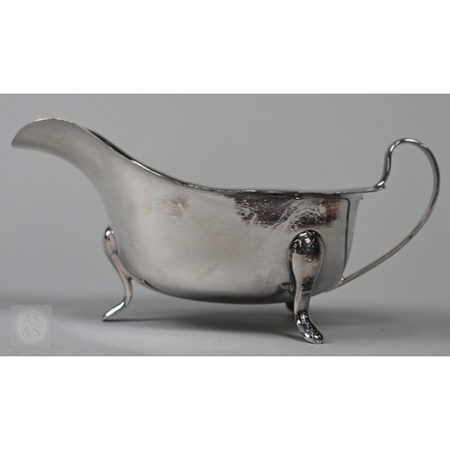 120 - A silver cream boat Viners, Sheffield 1961 and two pairs of sugar tongs, 5.2oz (163g) total, to/w a ... 