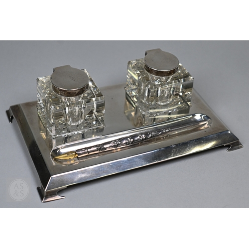 121 - A silver inkstand with two square cut gass inkwells with silver tops, S Blanckensee & Son Ltd., ... 
