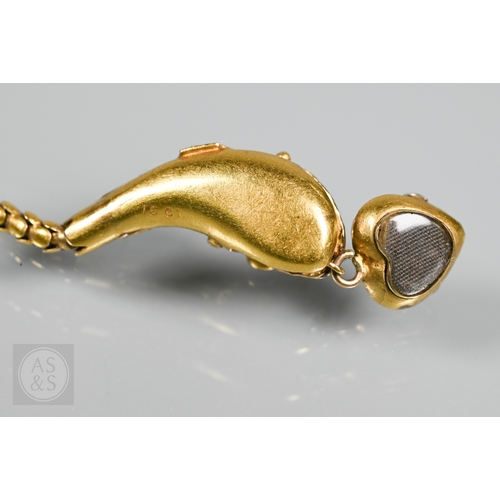 205 - An antique snake/serpent necklace, the snake head mounted with cabochon garnets and holding a heart-... 