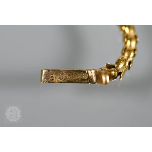 205 - An antique snake/serpent necklace, the snake head mounted with cabochon garnets and holding a heart-... 