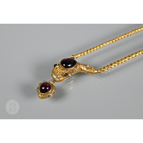 205 - An antique snake/serpent necklace, the snake head mounted with cabochon garnets and holding a heart-... 
