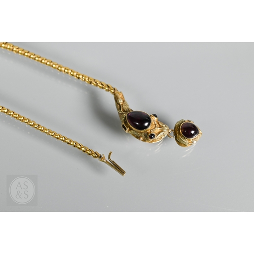 205 - An antique snake/serpent necklace, the snake head mounted with cabochon garnets and holding a heart-... 