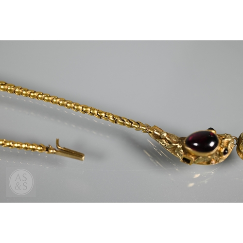 205 - An antique snake/serpent necklace, the snake head mounted with cabochon garnets and holding a heart-... 