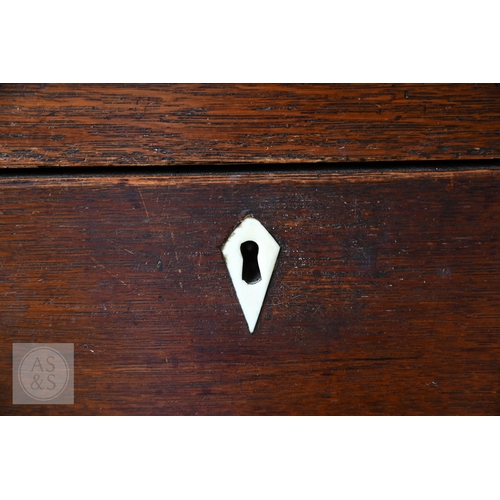 604 - An 18th century oak high dresser, the plank back open three tier rack over a base centred by four dr... 