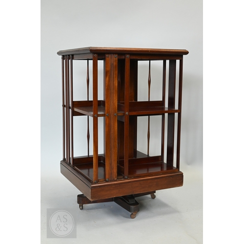 627 - A boxwood inlaid satinwood revolving bookcase, on castors, 51 cm x 51 cm x 82 cm h