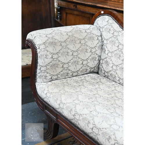676 - A Regency mahogany show framed sofa, the arched crest centred foliate moulding in relief, over scrol... 