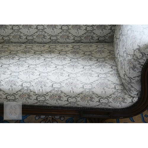 676 - A Regency mahogany show framed sofa, the arched crest centred foliate moulding in relief, over scrol... 