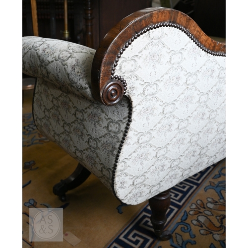 676 - A Regency mahogany show framed sofa, the arched crest centred foliate moulding in relief, over scrol... 