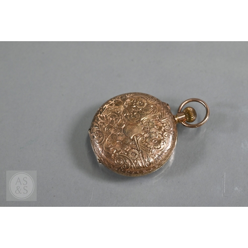 140 - A lady's 9ct gold fob watch, keyless wind, the white dial with gilt and blue Roman numerals, 31 mm d... 
