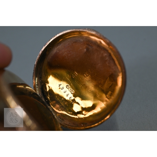 140 - A lady's 9ct gold fob watch, keyless wind, the white dial with gilt and blue Roman numerals, 31 mm d... 