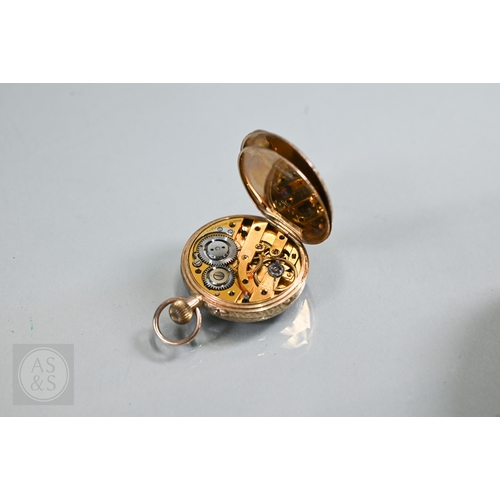140 - A lady's 9ct gold fob watch, keyless wind, the white dial with gilt and blue Roman numerals, 31 mm d... 