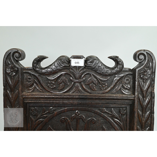 58 - An 19th century and later oak Wainscott armchair, the fielded back panel with twin dragons and folia... 