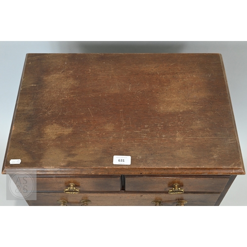 59 - A miniature Georgian style mahogany chest of two short over three long graduated drawers, with brass... 