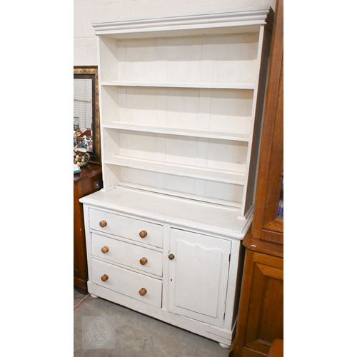147 - A vintage painted pine dresser with open plate rack on a base with three drawers and single cupboard... 